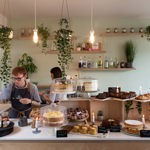 Staff working behind the counter at the Birdhouse Tea Bar & Kitchen.