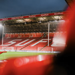 The stands at the Sheffield United FC grounds, lit up at night.