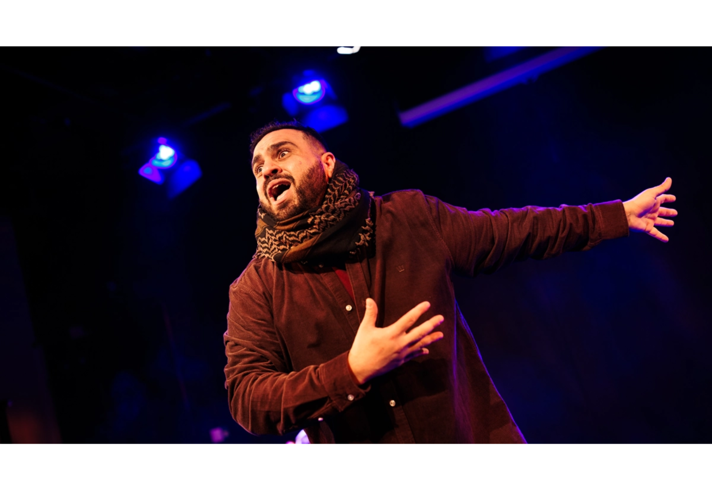 A person performing on a stage.