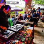 A DJ at the decks in the outdoor seating area at Jabbarwocky.