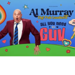 romotional poster for comedian Al Murray’s 2026 tour. A person in a burgundy blazer and striped tie stands against a bright blue background, holding a pint glass and striking a dramatic pose. Colourful rainbow swirls, hearts, stars, flowers and cartoon-style graphics surround the figure. Large text reads: “Al Murray The Pub Landlord. All You Need Is Guv.” A badge announces “Brand New 2026 Tour.”