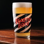 A glass of beer with the words 'Yeastie Boys' on it.