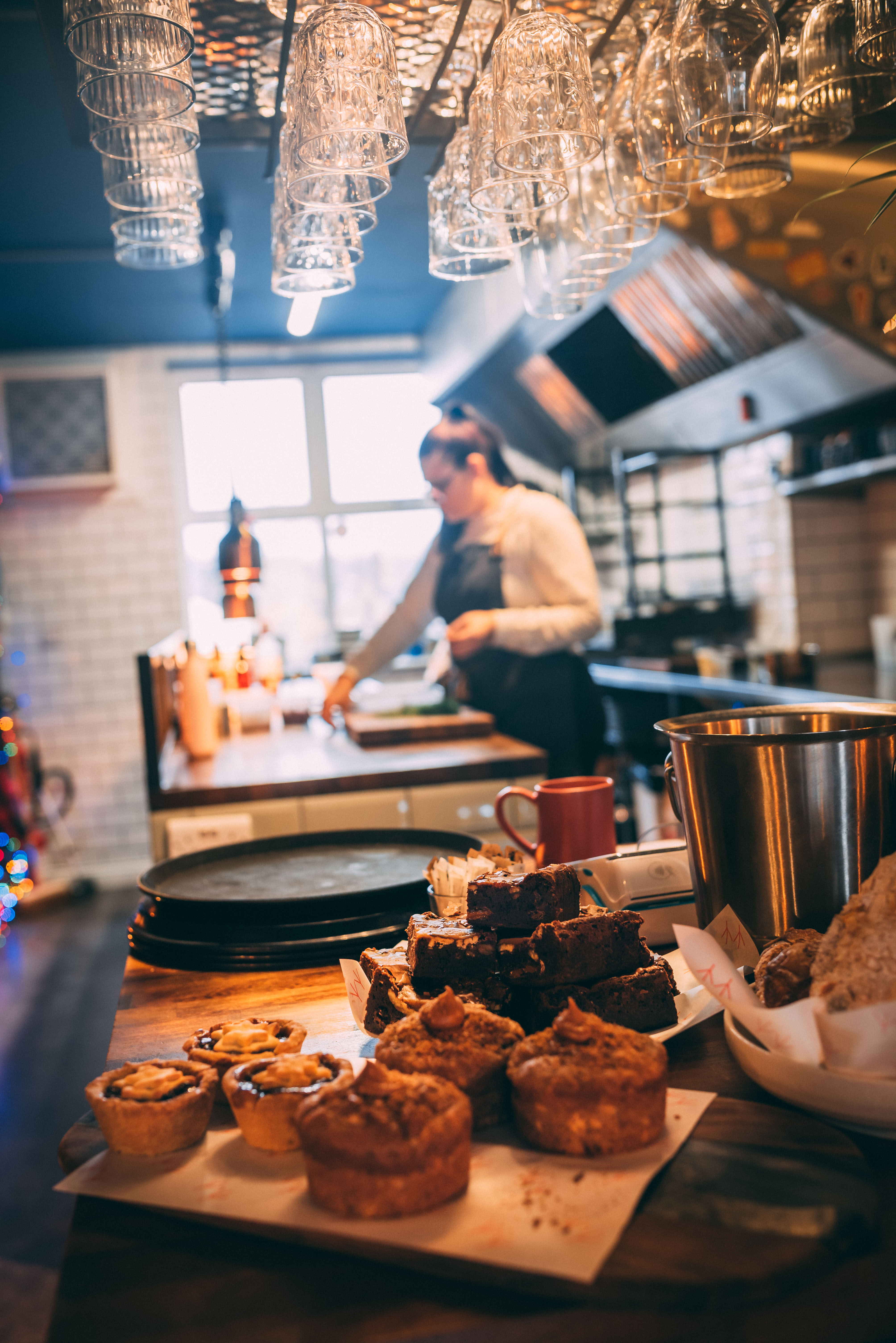 A chef is preparing food in a restaurant kitchen.