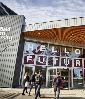 A building with the words 'Hello Future' spelled out on the glass frontage.