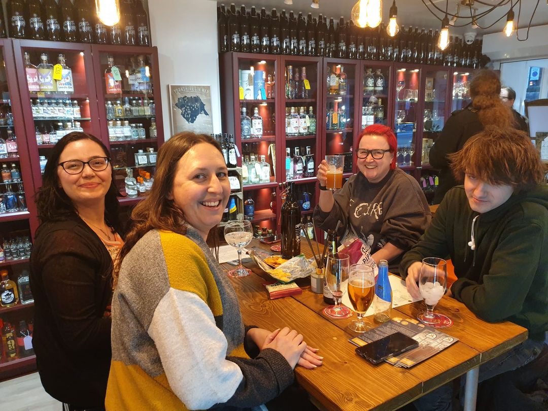 Four people enjoying a night out at Craft & Berry.