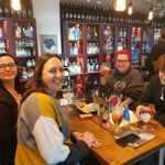 Four people enjoying a night out at Craft & Berry.