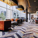 Contemporary bar area with large, comfortable seats and modern decor.