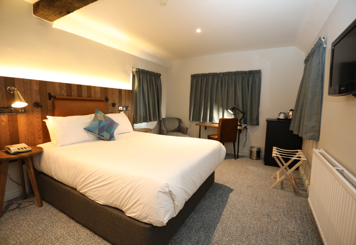 Double bedroom at Mercure Tankersley Manor with a comfortable bed, bedside tables, and soft lighting.