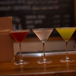 Three cocktails on a bar at Nonnas Restaurant.