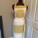 A tailor's dummy with an apron on it.