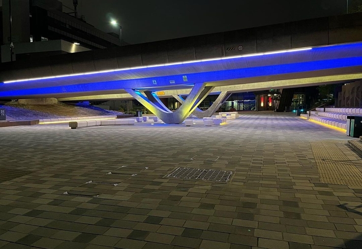 neon lighting under the bridge, next to the concourse outside the University of Sheffield Students' Union
