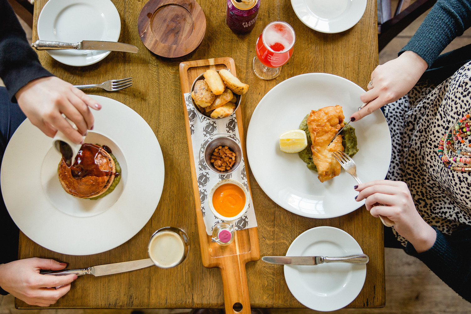 An overhead shot of people eating a meal at The Cricket Inn.