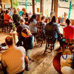 The interior of Cafe #9 filled with customers.