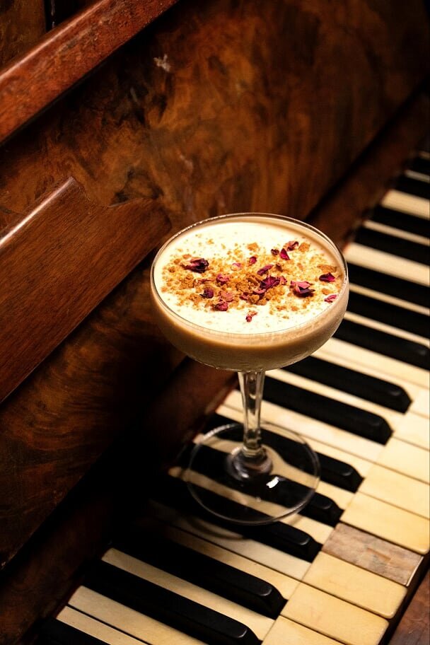 A cocktail on a piano keyboard.