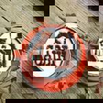 A cappuccino with The Cabin logo dusted onto the froth in chocolate powder.