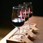 A row of filled wine glasses at True Loves.