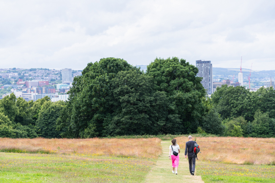 couple walking towards Norfolk heritage park