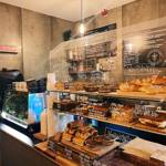 The counter at Gaard Coffee Hide, including a large glass case filled with baked goods.