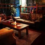 Comfortable sofas and chairs arranged around a low table at Jabbarwocky.