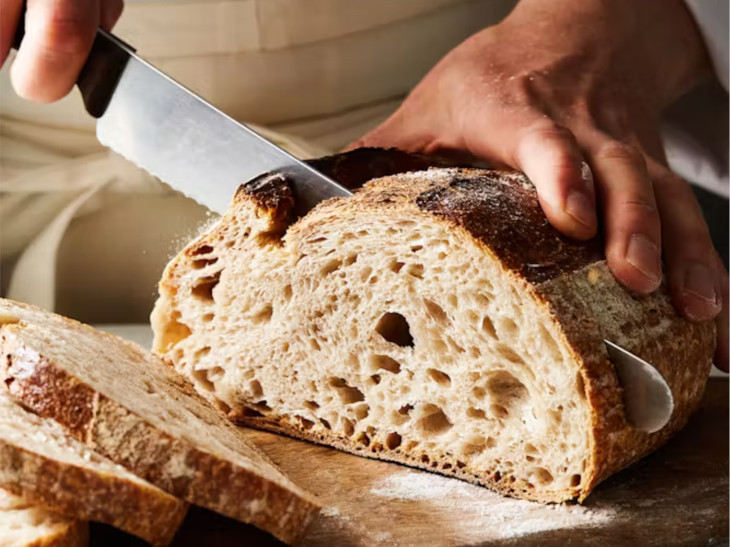 Bread being sliced at Dō Deli.