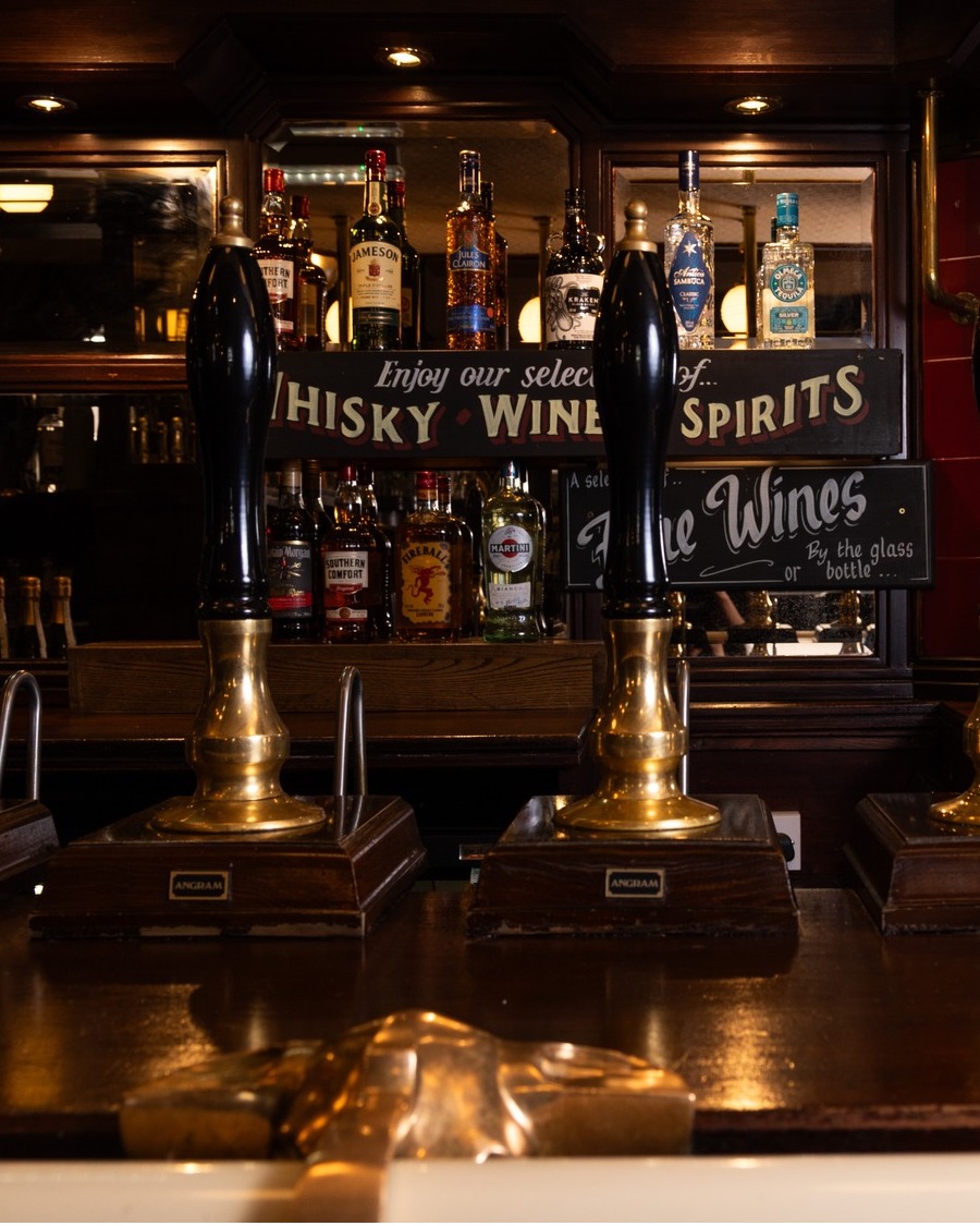 Traditional beer pumps at The Three Tuns