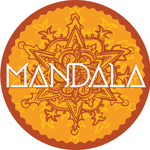 Circular mandala-style logo in warm shades of orange, gold and brown. An intricate floral and geometric pattern fills the centre, surrounded by decorative symmetrical details. Across the middle, the word “MANDALA” appears in large white stylised lettering with angular shapes. The design sits within a scalloped circular border on a transparent background.