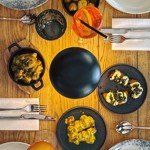 An overhead shot a meal laid out on a wooden table.