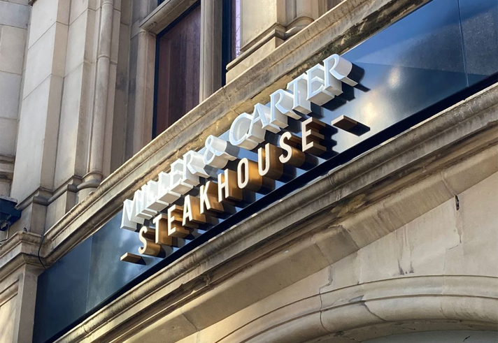 The Miller & Carter Steakhouse sign above the entrance to the restaurant.