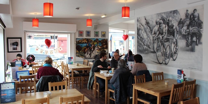 The clean, modern interior of Amici & Bici, with lots of cycling memorabilia.