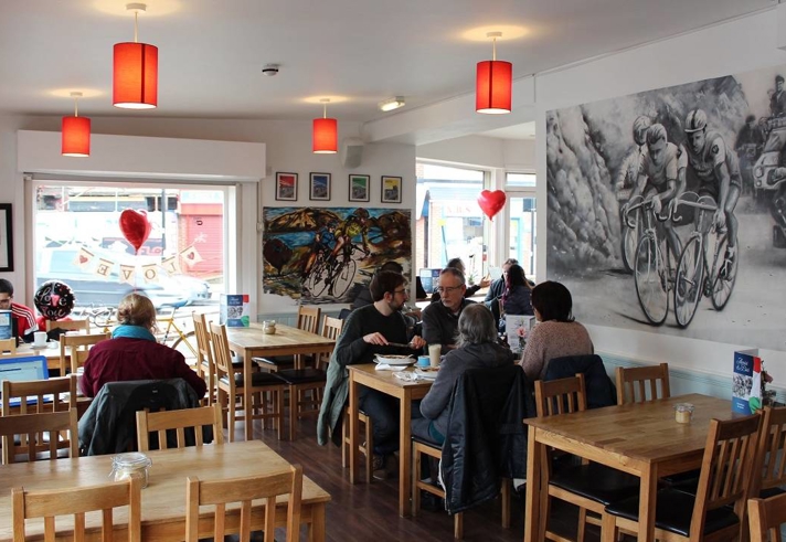 The clean, modern interior of Amici & Bici, with lots of cycling memorabilia.