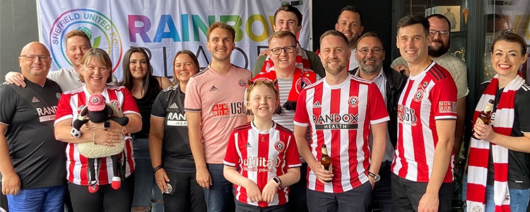 Football fans smiling at the camera