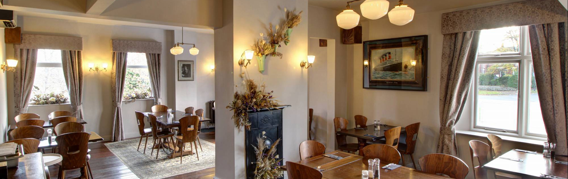 The interior of The Horse & Jockey with wooden floors and a bright and welcoming atmosphere.