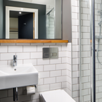 A bathroom with shower at the ibis Budget Sheffield Centre - St Mary's Gate.