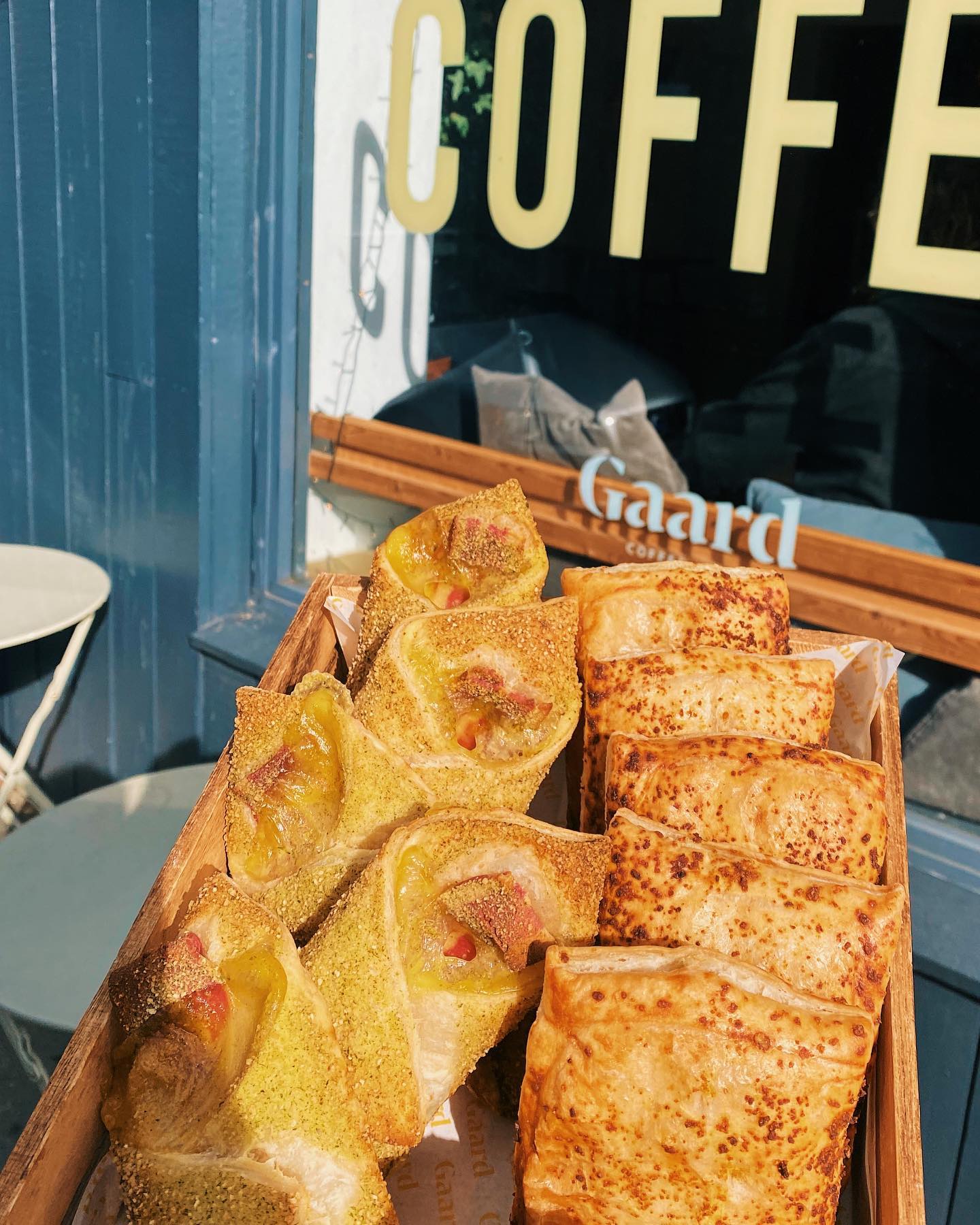 Baked goods on a wooden tray at Gaard Coffee Hide.