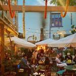 The courtyard at Haggles Coner, filled with people dining.