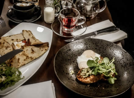 A meal for two laid out on a table at Inox Dine.