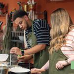 People learning to prepare food and cook.
