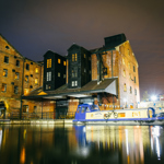 Victoria Quays lit up at night.
