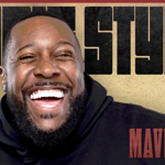 headshot of Aurie Styla smiling broadly and laughing