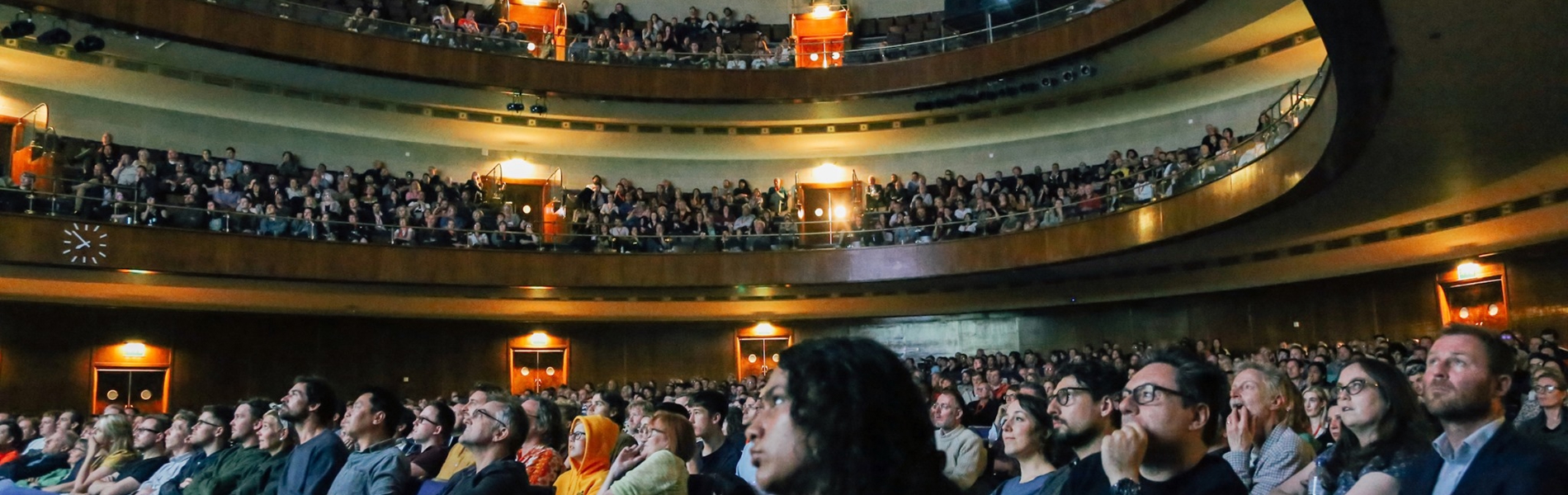 An audience inside the Oval Hall at The City Hall in Sheffield.