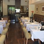 Rows of tables beautifully laid out at the All Siam Thai Restaurant.