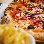 A pizza on a table.