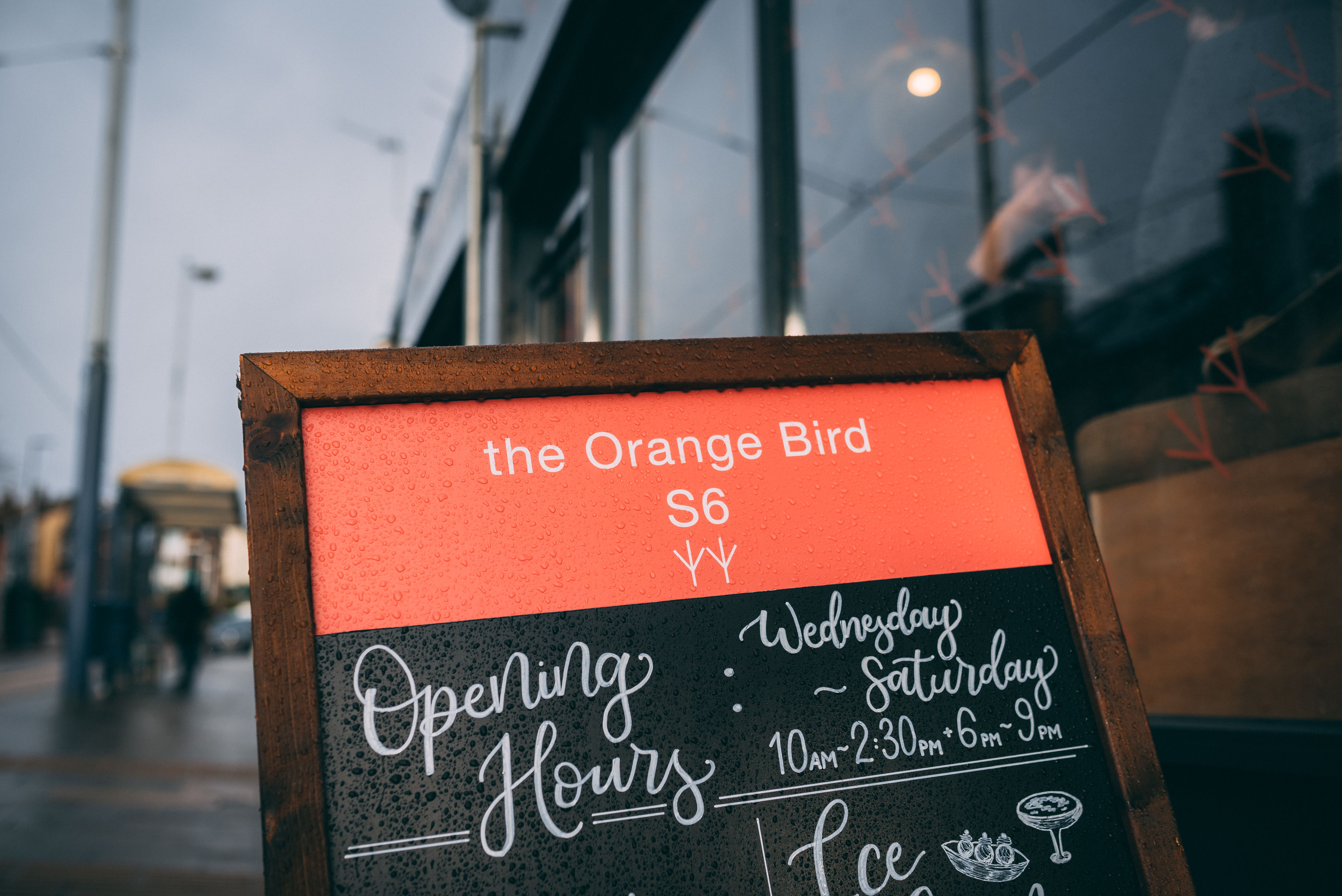  A blackboard outside The Orange Bird with the opening times.