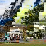 Tents set up in the grounds of Sheffield Botanical Gardens.