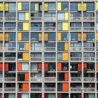 A detail of the refurbished Park Hill Flats with colourful yellow, orange and red panels.