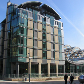 The Mercure Sheffield St Pauls Hotel  & Spa in bright sunshine, next to the Sheffield Winter Garden and the Millennium Square.