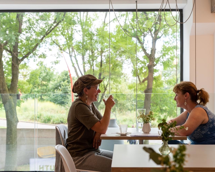 Two people sat at a table in the window at South Street Kitchen.