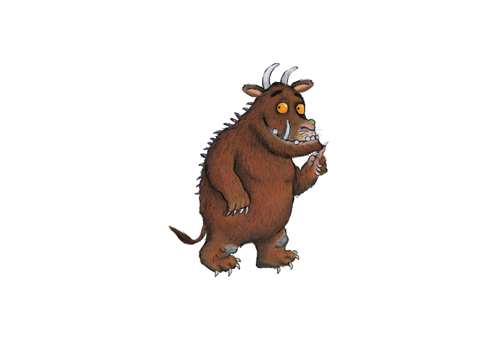 Illustration of the Gruffalo, a fictional creature with shaggy brown fur, curved white horns, bright yellow eyes, large tusks, sharp claws and purple spikes running down its back. The character stands upright with a small tail and holds one clawed hand up. The image has a plain light grey background and is drawn in a detailed storybook style.