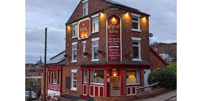 The exterior of the Sheaf View at dusk.