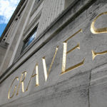 The word Graves carved into the stone fascia of the building.
